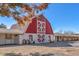 Exterior view of a barn-style building with a white and red facade, featuring 'Sierra Vista Ranchos' signage at 2868 Vista Del Sol Ave, Las Vegas, NV 89120