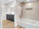 Bathroom featuring a modern tub, stylish tile work, and a vanity with sleek fixtures at 2868 Vista Del Sol Ave, Las Vegas, NV 89120