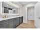 Modern bathroom with double vanity, quartz countertops, and a large mirror at 2868 Vista Del Sol Ave, Las Vegas, NV 89120