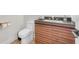 Modern bathroom boasts a stylish vanity with black countertop, a sleek sink, and a contemporary toilet at 2868 Vista Del Sol Ave, Las Vegas, NV 89120