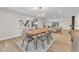 Open concept dining room with modern lighting and wood floors at 2868 Vista Del Sol Ave, Las Vegas, NV 89120