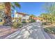 Beautiful two-story home with a tile roof and lush, mature landscaping at 2868 Vista Del Sol Ave, Las Vegas, NV 89120