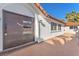 Modern garage door detailing with a Spanish-style tiled roof and exterior lighting at 2868 Vista Del Sol Ave, Las Vegas, NV 89120
