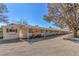 Exterior shot of horse stables, displaying the stalls, adjacent shed, and comfortable surrounding area at 2868 Vista Del Sol Ave, Las Vegas, NV 89120