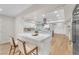 Spacious kitchen with a breakfast bar island, white cabinets, and stainless steel appliances at 2868 Vista Del Sol Ave, Las Vegas, NV 89120