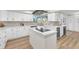 Open kitchen with a center island, white cabinetry, and stainless steel appliances at 2868 Vista Del Sol Ave, Las Vegas, NV 89120
