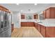 Modern kitchen features stainless steel appliances, wood cabinets, and white countertops at 2868 Vista Del Sol Ave, Las Vegas, NV 89120