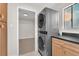 Efficient laundry room features stacked washer/dryer and convenient access to a large walk-in closet at 2868 Vista Del Sol Ave, Las Vegas, NV 89120