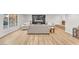 Large living room with hardwood floors and a modern fireplace accent wall at 2868 Vista Del Sol Ave, Las Vegas, NV 89120