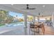 Covered patio featuring ceiling fans, a dining table and backyard pool at 2868 Vista Del Sol Ave, Las Vegas, NV 89120