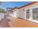 Spacious patio area with elegant French doors, perfect for enjoying outdoor living and entertaining at 2868 Vista Del Sol Ave, Las Vegas, NV 89120