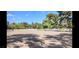 Large riding arena with white fencing, surrounded by trees at 2868 Vista Del Sol Ave, Las Vegas, NV 89120