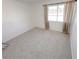 Well-lit bedroom featuring neutral carpeting and window coverings at 3004 El Camino Ave, Las Vegas, NV 89102