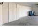 Garage interior with built-in white cabinets and trash bins at 3004 El Camino Ave, Las Vegas, NV 89102