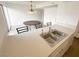 Kitchen features a breakfast bar, double sink, and white countertops at 3004 El Camino Ave, Las Vegas, NV 89102