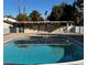 Community pool with surrounding patio and building at 3004 El Camino Ave, Las Vegas, NV 89102