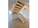 Modern staircase with light-colored carpeting and metal railings at 3004 El Camino Ave, Las Vegas, NV 89102