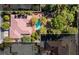 Aerial view of a large house with pool, and pond with rock features at 3841 Hildebrand Ln, Las Vegas, NV 89121