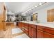 Expansive main bathroom with double sinks, vanity, and abundant mirror space at 3841 Hildebrand Ln, Las Vegas, NV 89121