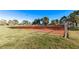 Red dirt baseball field with well-kept grass, provides an athletic space for sports and recreation at 2368 Winterwood Blvd, Las Vegas, NV 89142