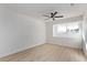 Bright bedroom with large window and ceiling fan at 2368 Winterwood Blvd, Las Vegas, NV 89142