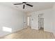 Well-lit bedroom with ceiling fan and ample closet space at 2368 Winterwood Blvd, Las Vegas, NV 89142