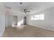 Spacious bedroom featuring two closets, a ceiling fan, and natural light from the window at 2368 Winterwood Blvd, Las Vegas, NV 89142