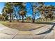 Landscaped community park with mature trees and walking paths at 2368 Winterwood Blvd, Las Vegas, NV 89142