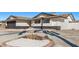 Charming exterior featuring desert landscaping and a spacious driveway at 2368 Winterwood Blvd, Las Vegas, NV 89142