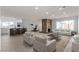 Bright, open-concept living room featuring a stone fireplace and modern finishes at 2368 Winterwood Blvd, Las Vegas, NV 89142