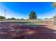 View of tennis court, a recreational facility, with tall lighting fixtures set against a clear blue sky at 2368 Winterwood Blvd, Las Vegas, NV 89142