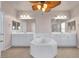 Double vanity bathroom with large soaking tub and separate shower at 2410 Encouraging Ct, Henderson, NV 89052