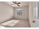 Bright bedroom featuring carpet flooring and a ceiling fan at 2410 Encouraging Ct, Henderson, NV 89052