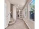 Carpeted stairs and tiled floor in the entryway with built-in shelving at 2410 Encouraging Ct, Henderson, NV 89052