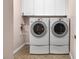 Laundry room with washer, dryer, and cabinets at 2410 Encouraging Ct, Henderson, NV 89052