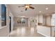 Open living room with tile floors and a view into the kitchen at 2410 Encouraging Ct, Henderson, NV 89052