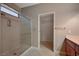 Bright bathroom with a large glass enclosed shower and open walk-in closet at 2820 Goldcreek St, Henderson, NV 89052