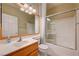 Bathroom featuring a vanity with sink and a bathtub with glass sliding doors at 2820 Goldcreek St, Henderson, NV 89052