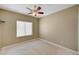 Bedroom featuring neutral walls, carpeted flooring, and a ceiling fan at 2820 Goldcreek St, Henderson, NV 89052