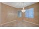 A formal dining room with great natural light and an elegant chandelier at 2820 Goldcreek St, Henderson, NV 89052