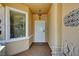 Inviting covered front entryway with decorative security door and tiled floor at 2820 Goldcreek St, Henderson, NV 89052