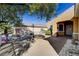 A desert home features a fenced-in front patio area with exterior stucco, landscaping, and covered front porch at 2820 Goldcreek St, Henderson, NV 89052