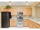 Functional kitchen with light wood cabinets, granite countertops, and stainless steel appliances at 2820 Goldcreek St, Henderson, NV 89052