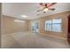 Bright living room featuring tiled floor, ceiling fan and sliding glass doors to the backyard at 2820 Goldcreek St, Henderson, NV 89052