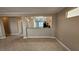 Open-concept living space with tile floors, natural lighting, and seamless flow to the kitchen at 2820 Goldcreek St, Henderson, NV 89052