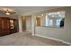 Bright living area with a ceiling fan, neutral walls, tile flooring, and an adjacent kitchen and dining area at 2820 Goldcreek St, Henderson, NV 89052