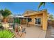 Back patio featuring a gazebo, seating area, and manicured landscaping at 2820 Goldcreek St, Henderson, NV 89052