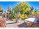 Landscaped backyard with hammock and mature trees at 5912 Sea Hunter St, North Las Vegas, NV 89031