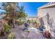 Landscaped backyard with grill and patio at 5912 Sea Hunter St, North Las Vegas, NV 89031