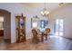 Charming dining room features a glass-top table and wicker chairs at 5912 Sea Hunter St, North Las Vegas, NV 89031